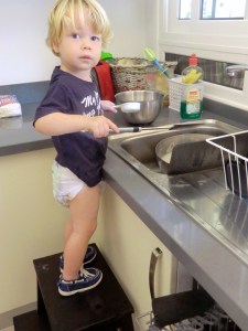 "Helping" mommy with the dishes
